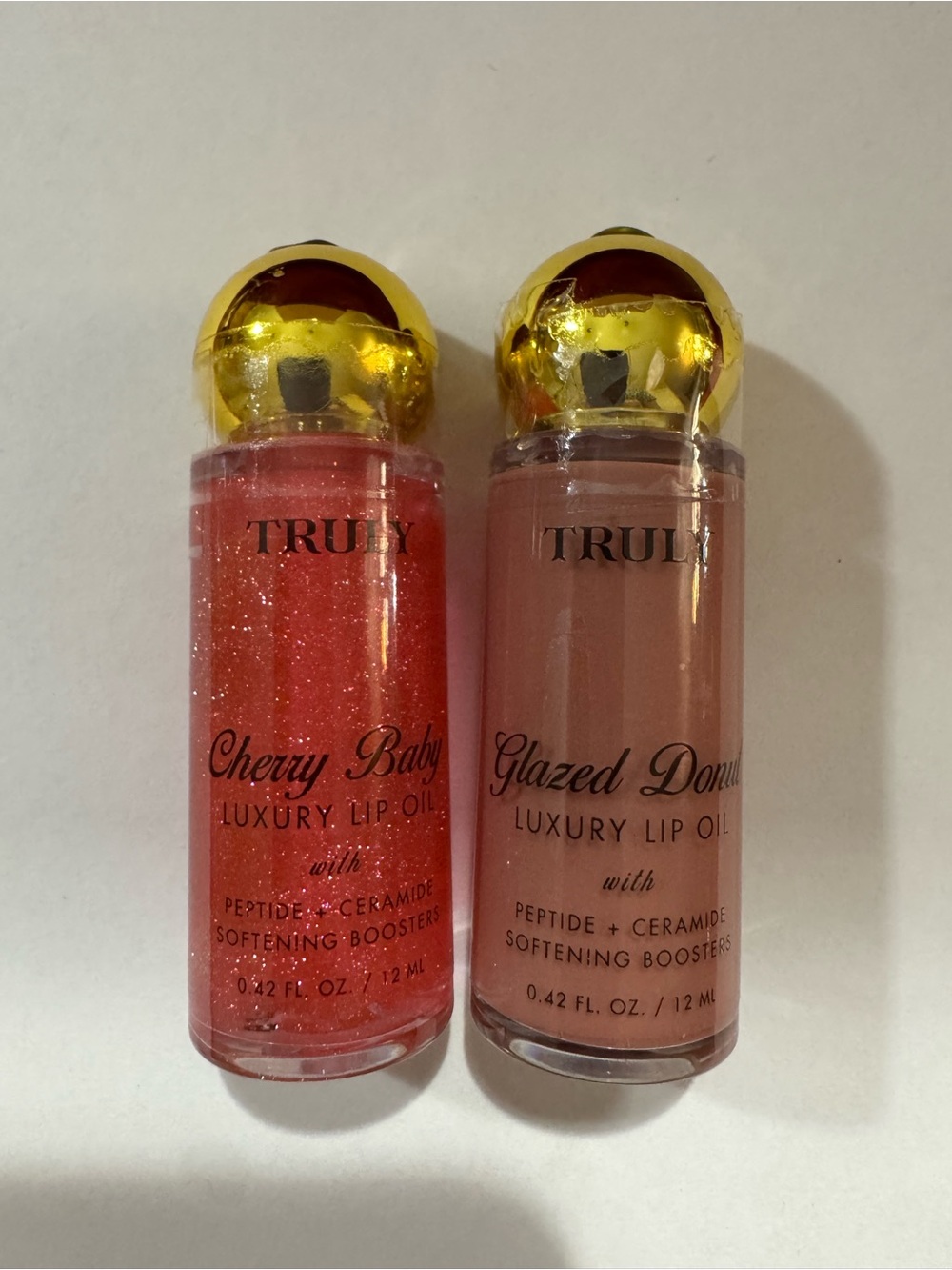 TRULY Cherry Baby & Glazed Donut Lip Oil Duo - Sparkling Pink & Nude Beige